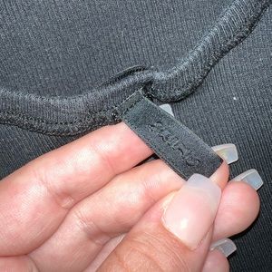 Brand is Skims, size M, black.